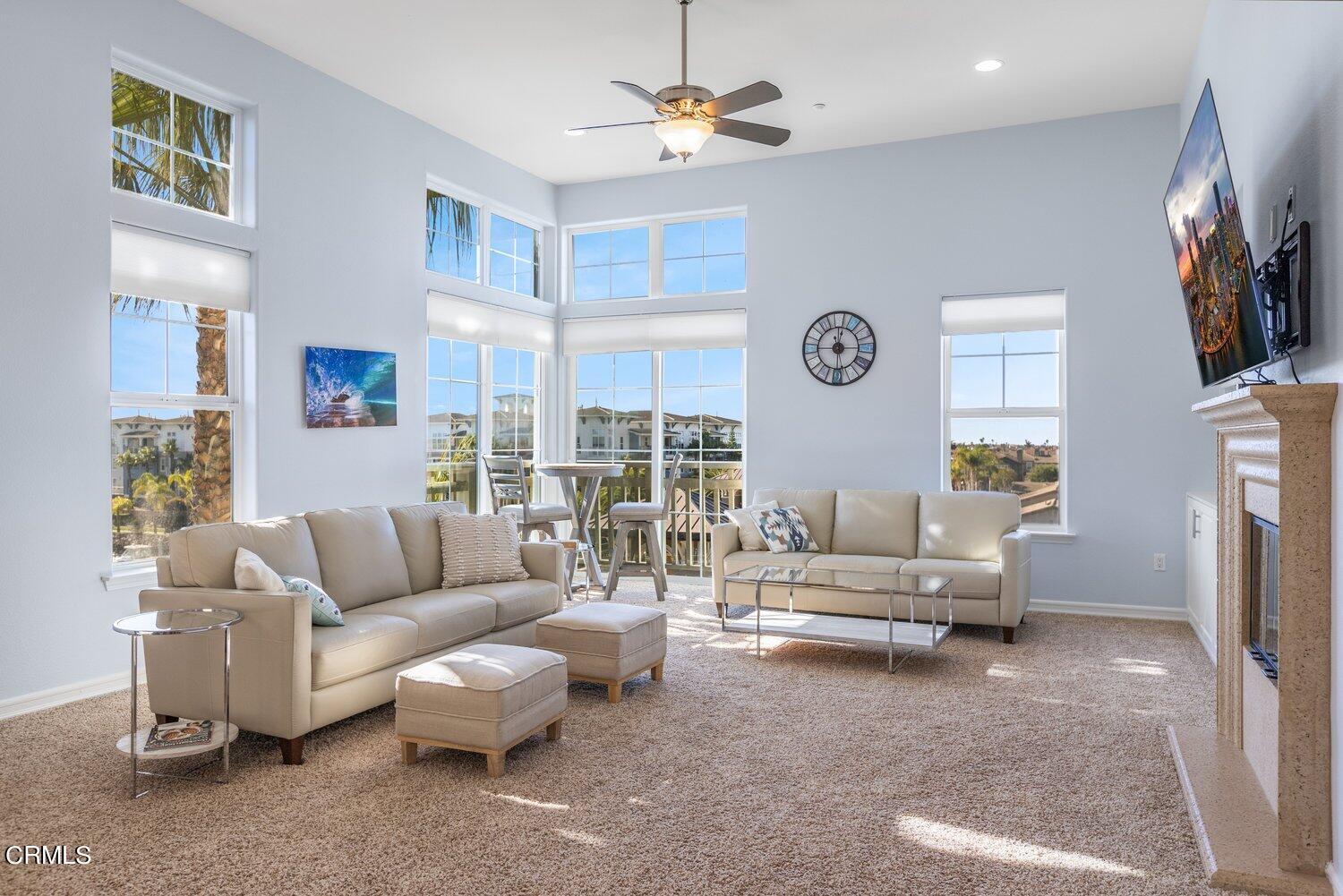 1481 Windshore Way Oxnard, CA 93035 - Photo 8 of 31 a living room with fireplace furniture and a flat screen tv