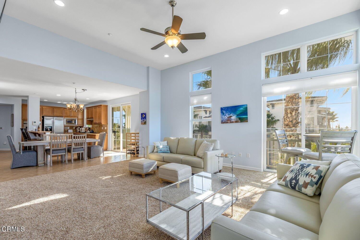 1481 Windshore Way Oxnard, CA 93035 - Photo 9 of 31 a living room with furniture and a dining table