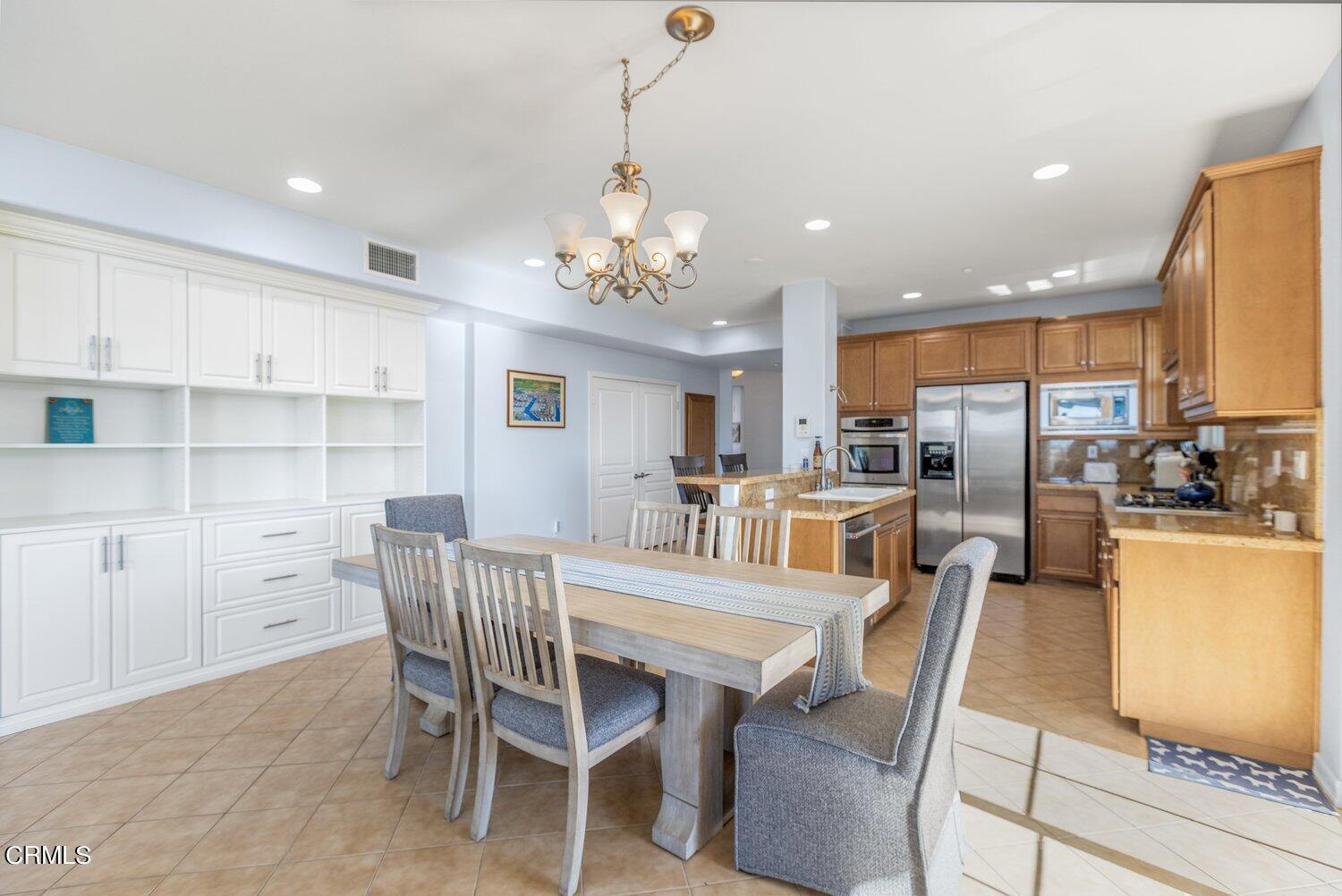 1481 Windshore Way Oxnard, CA 93035 - Photo 10 of 31 a view of a dining room with furniture