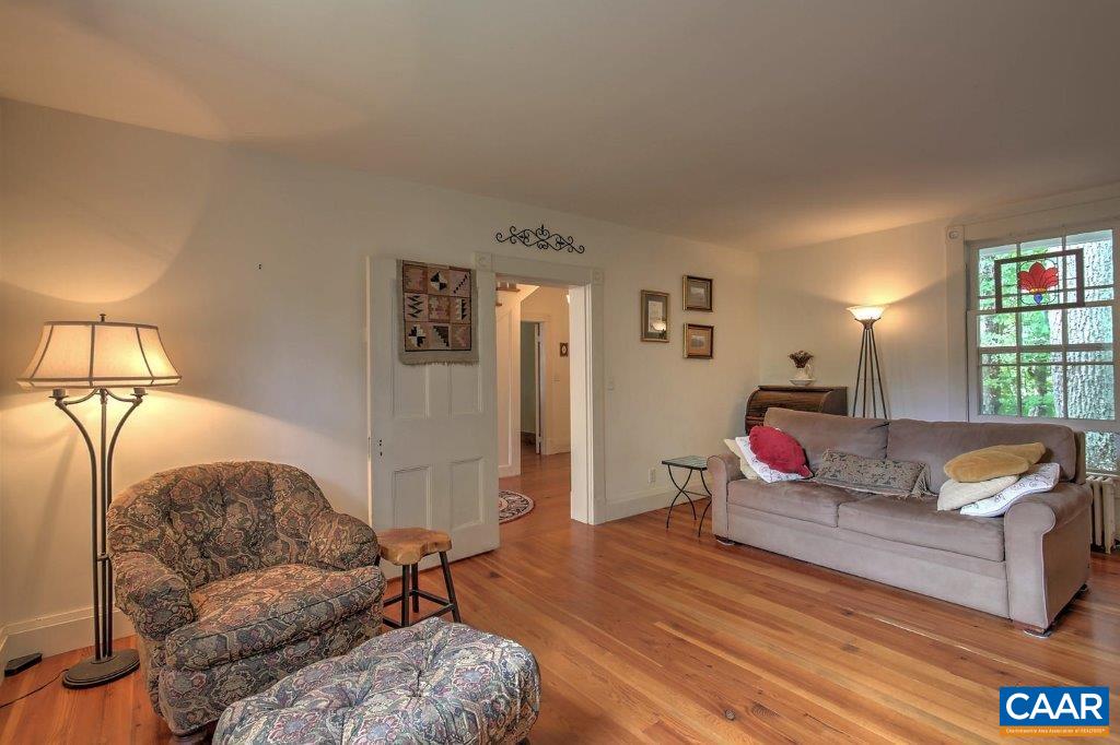528 Top Ridge Road Stanardsville, VA 22973 - Photo 13 of 45 a living room with furniture and a wooden floor