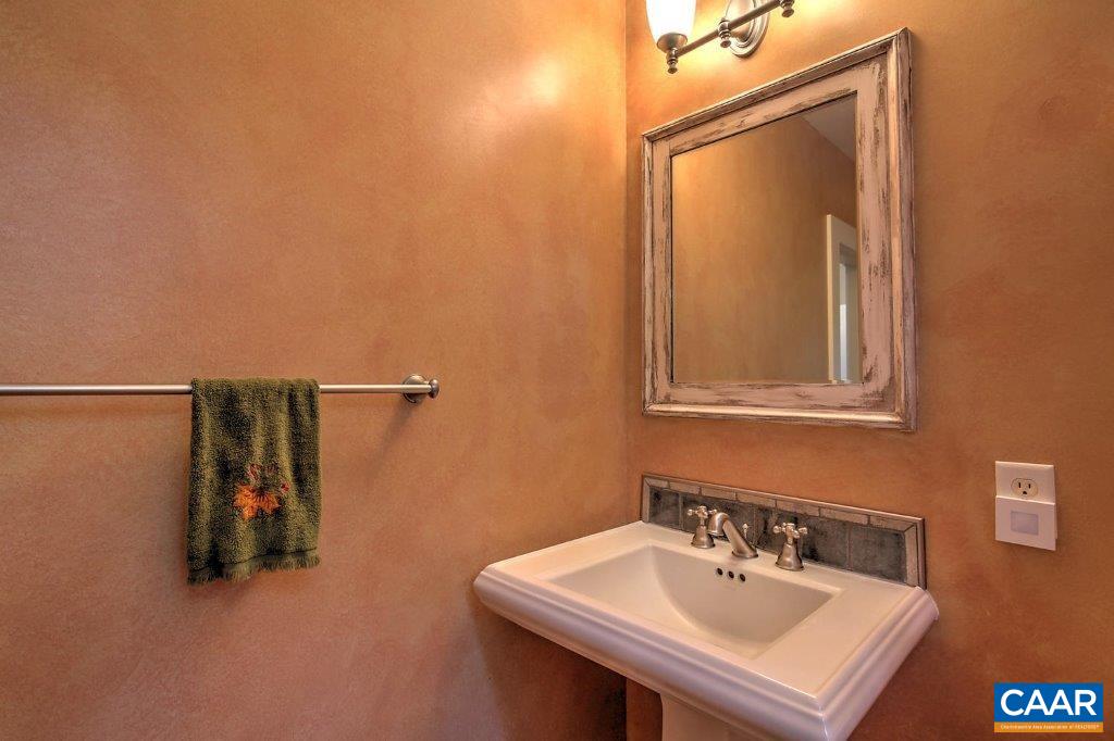 528 Top Ridge Road Stanardsville, VA 22973 - Photo 17 of 45 a bathroom with a sink a mirror and vanity