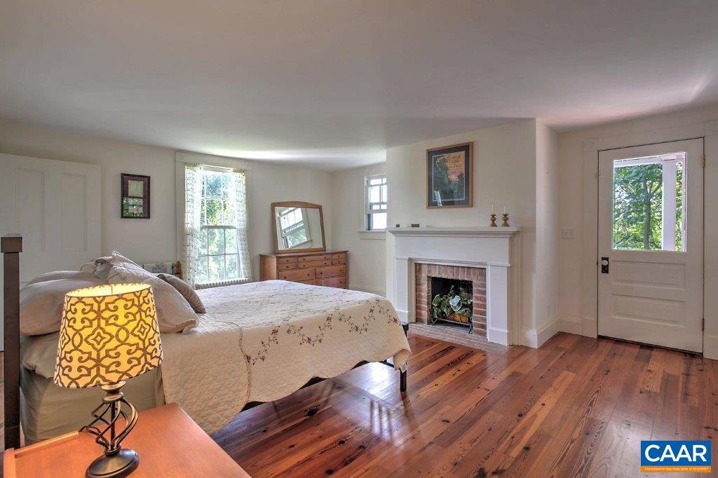 528 Top Ridge Road Stanardsville, VA 22973 - Photo 20 of 45 a living room with furniture and a fireplace