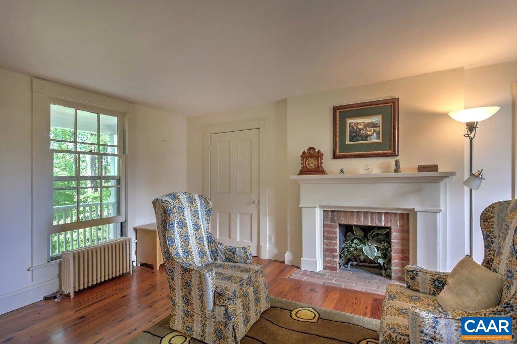 528 Top Ridge Road Stanardsville, VA 22973 - Photo 28 of 45 a living room with furniture and a fireplace
