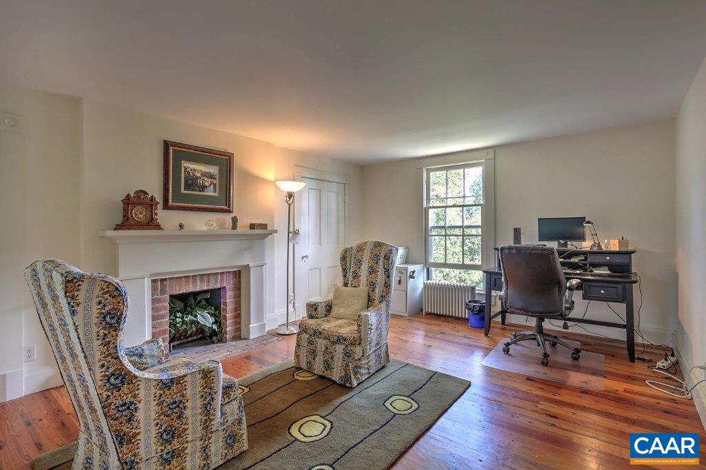 528 Top Ridge Road Stanardsville, VA 22973 - Photo 29 of 45 a living room with furniture fireplace and window