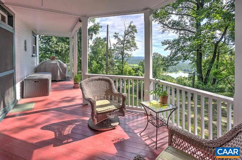 528 Top Ridge Road Stanardsville, VA 22973 - Photo 31 of 45 a view of a chair in wooden deck