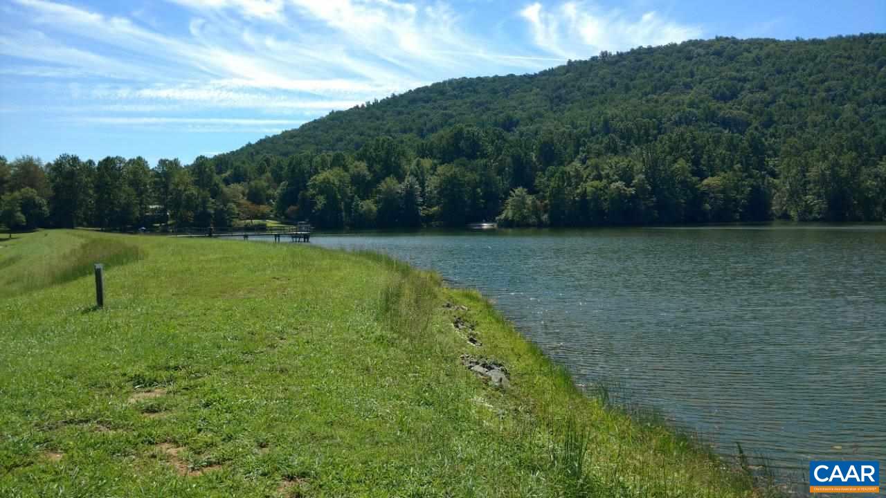 528 Top Ridge Road Stanardsville, VA 22973 - Photo 41 of 45 a view of a golf course with a lake