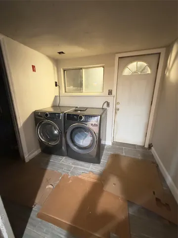 a bathroom with a sink a toilet and a shower