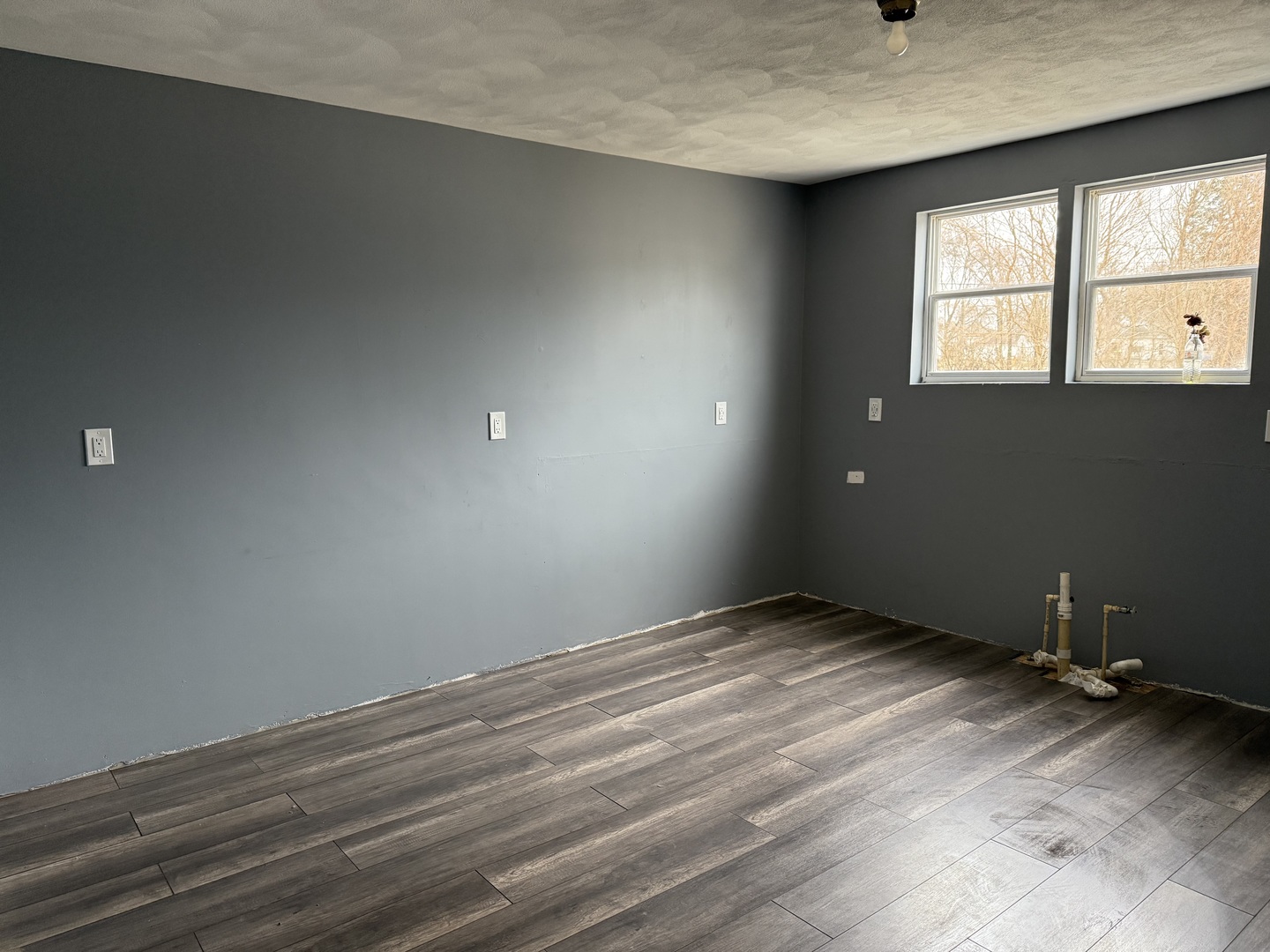 411 Jefferson Street Henry, IL 61537 - Photo 13 of 17 an empty room with wooden floor and windows