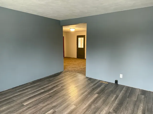 a view of a livingroom with wooden floor