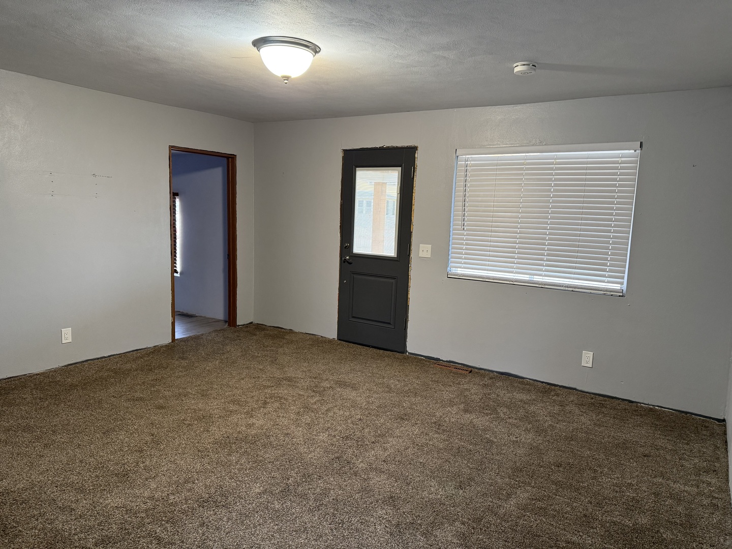 411 Jefferson Street Henry, IL 61537 - Photo 6 of 17 an empty room with windows
