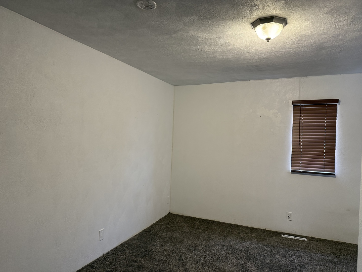 411 Jefferson Street Henry, IL 61537 - Photo 8 of 17 an empty room with a window