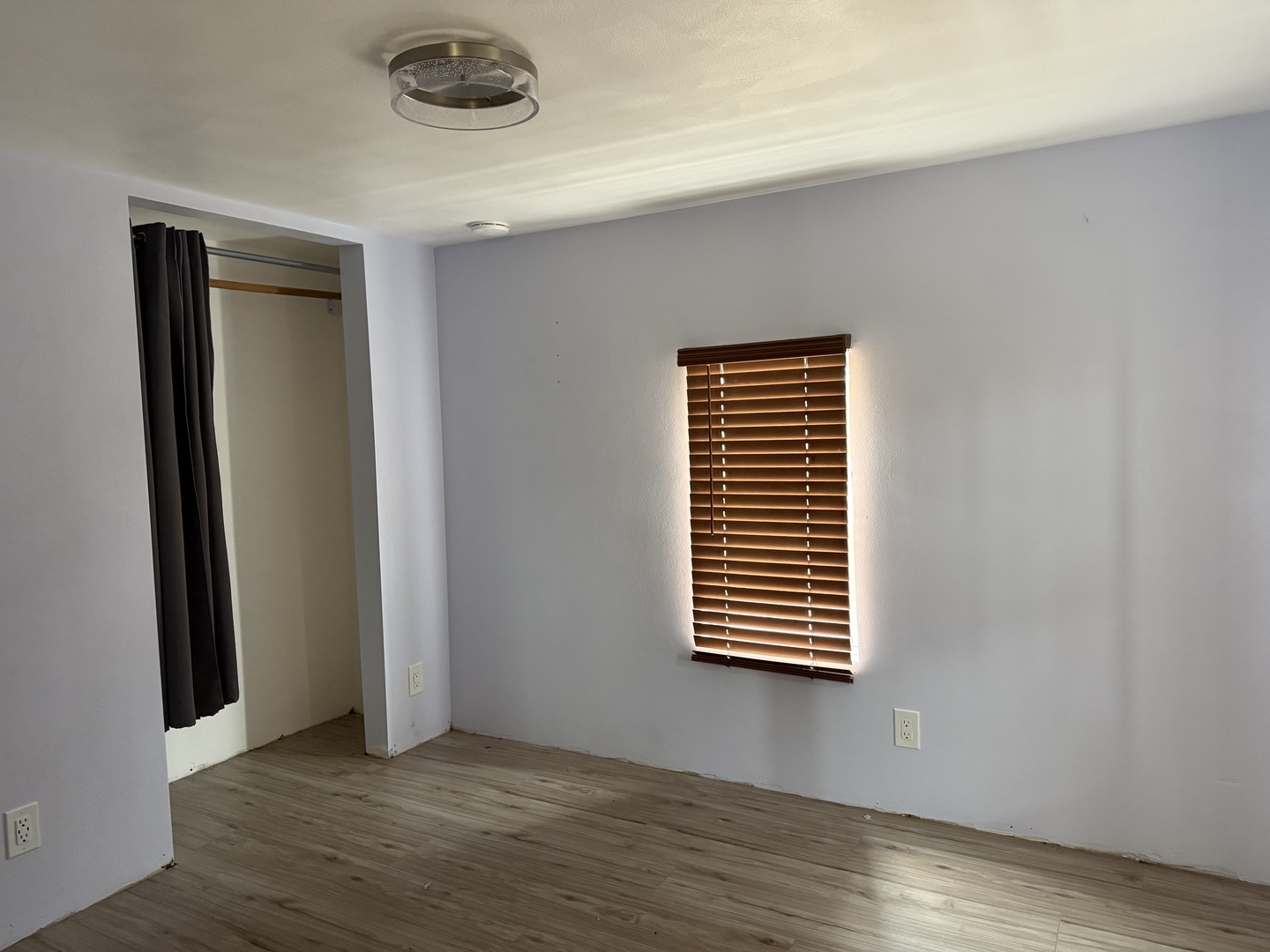 411 Jefferson Street Henry, IL 61537 - Photo 9 of 17 an empty room with wooden floor and windows
