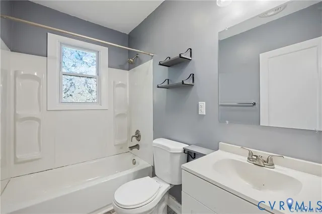 a bathroom with a toilet sink and bathtub