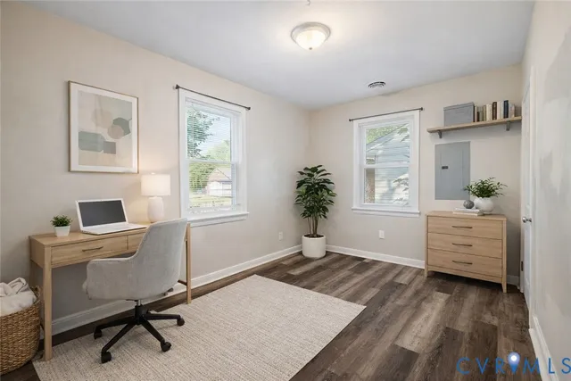 a workspace with furniture and window