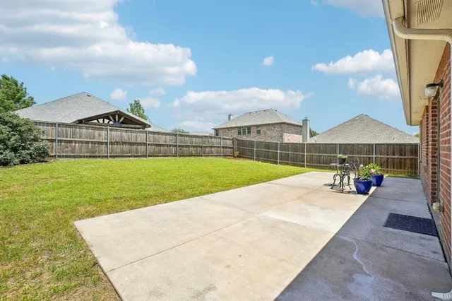 a view of a house with swimming pool and a yard