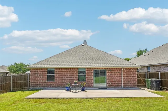a front view of house with yard and seating area