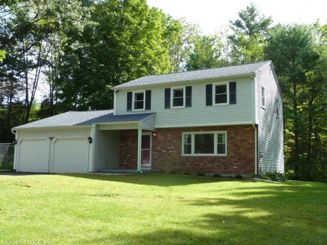 10 Petersen Road Granby, CT 06035 - Photo 1 of 1 a front view of a house with a garden