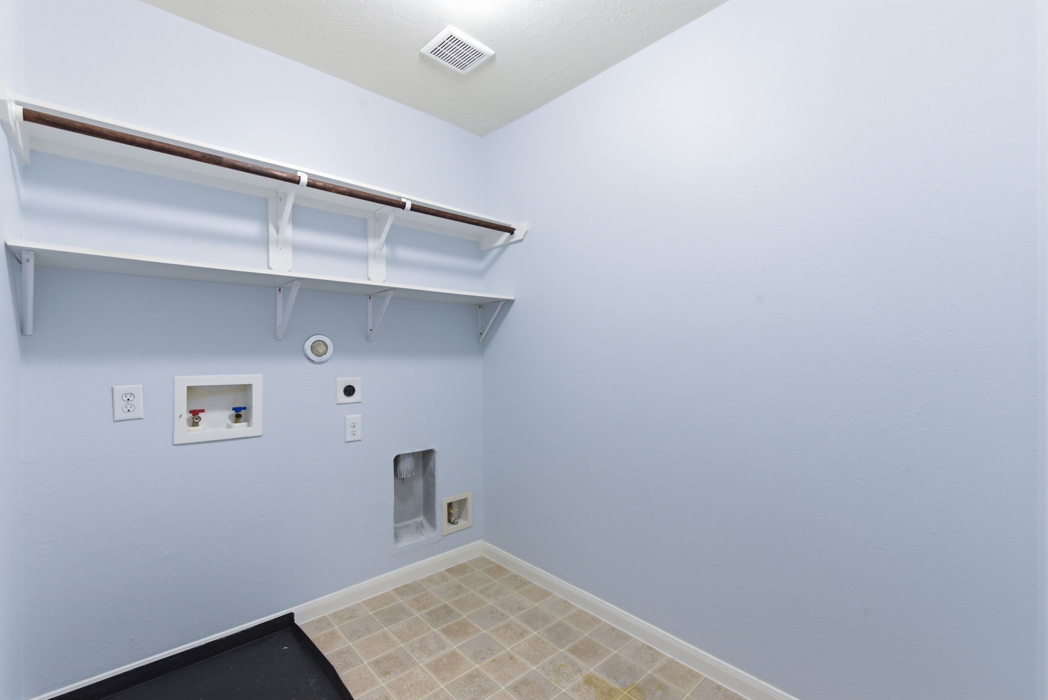 10510 Day Trail Lane Spring, TX 77379 - Photo 18 of 23 No detail was overlooked! The indoor laundry and utility room offers additional built-in shelving to keep your home perfectly organized.