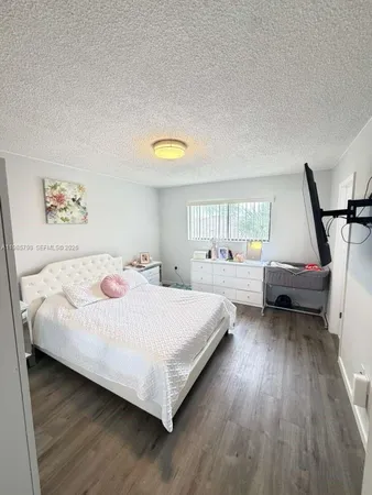 a bed room with a bed and a window