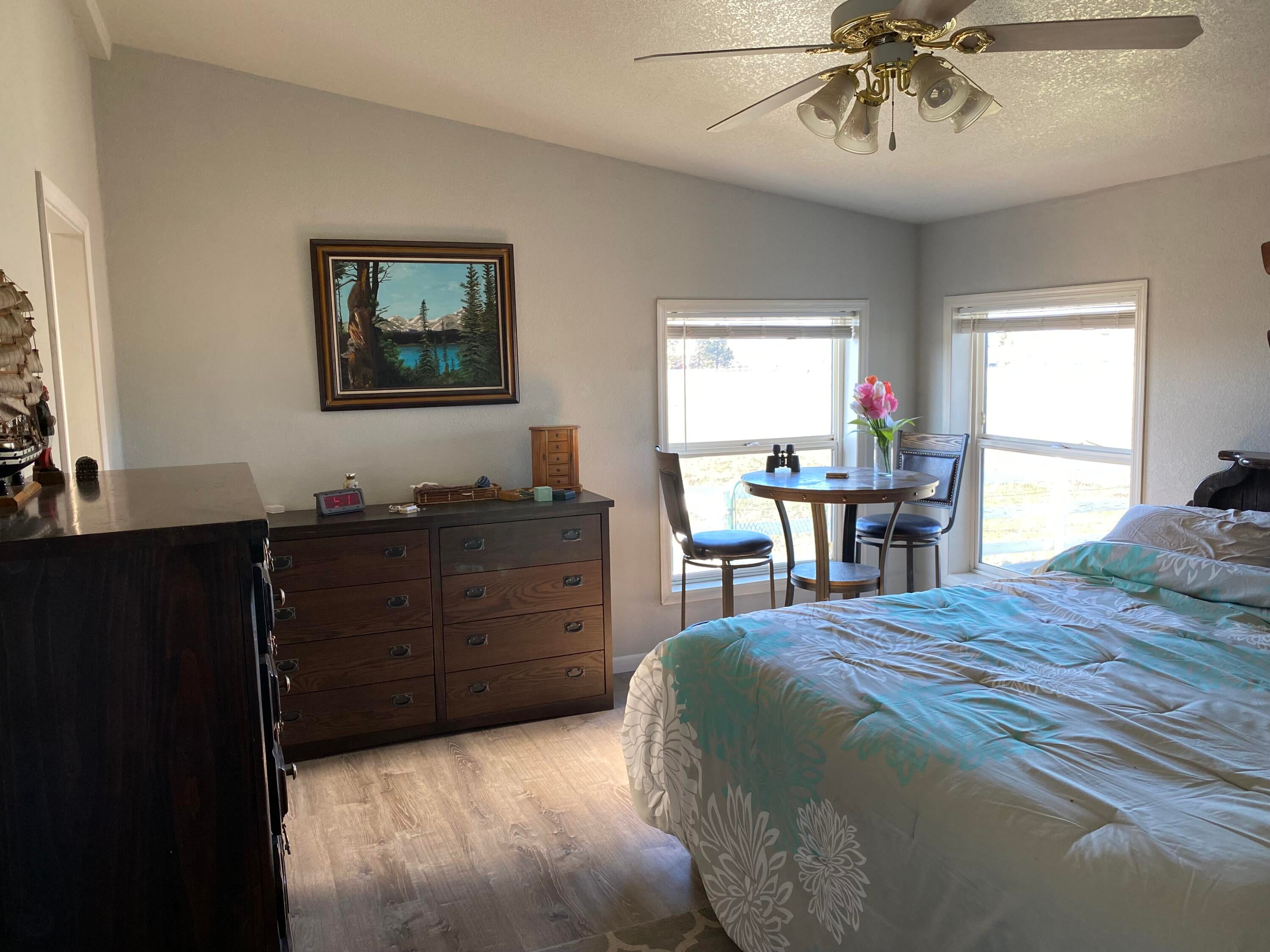 32227 Rivers Drive Chiloquin, OR 97624 - Photo 14 of 55 Primary bedroom, ceiling fan and vinyl windows throughout