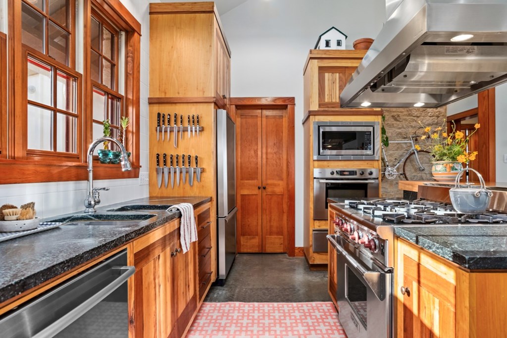 309 Ridgeview Drive Fredericksburg, TX 78624 - Photo 15 of 32 a kitchen with stainless steel appliances granite countertop a stove and a sink