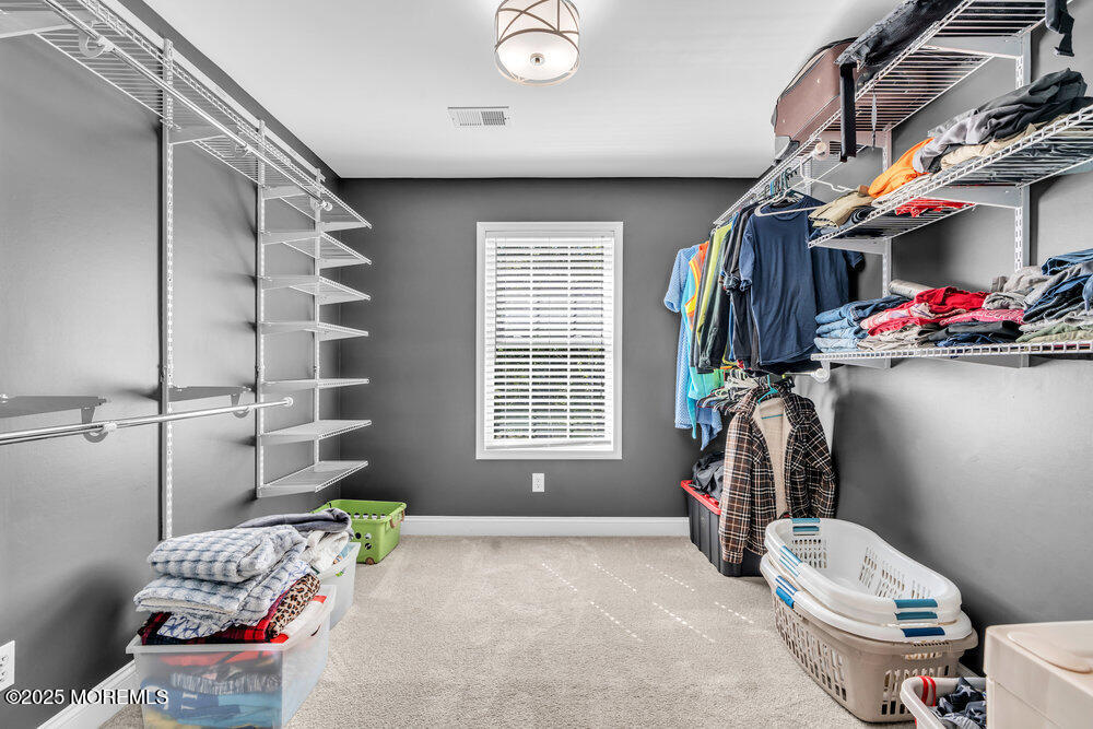 225 East Bird Village Road Jackson, NJ 08527 - Photo 31 of 69 a bedroom with a bed and a window