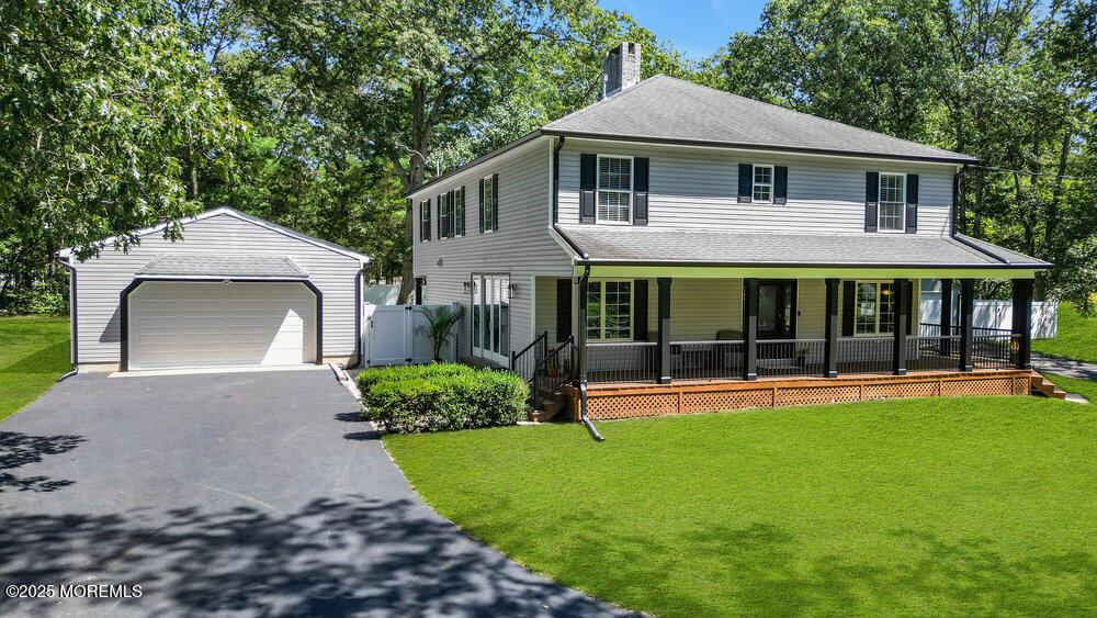 225 East Bird Village Road Jackson, NJ 08527 - Photo 4 of 69 a front view of a house with a yard and green space