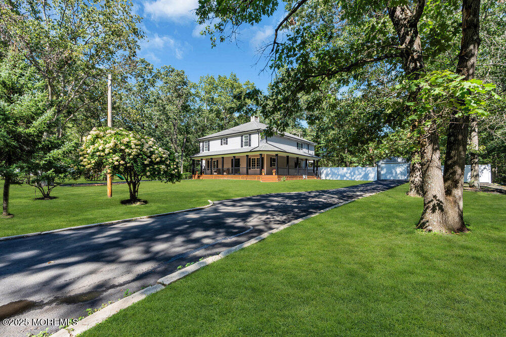 225 East Bird Village Road Jackson, NJ 08527 - Photo 58 of 69 a front view of a house with a yard