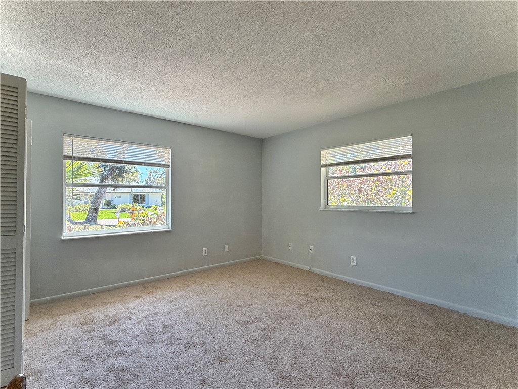 715 Holly Road Vero Beach, FL 32963 - Photo 12 of 25 an empty room with windows