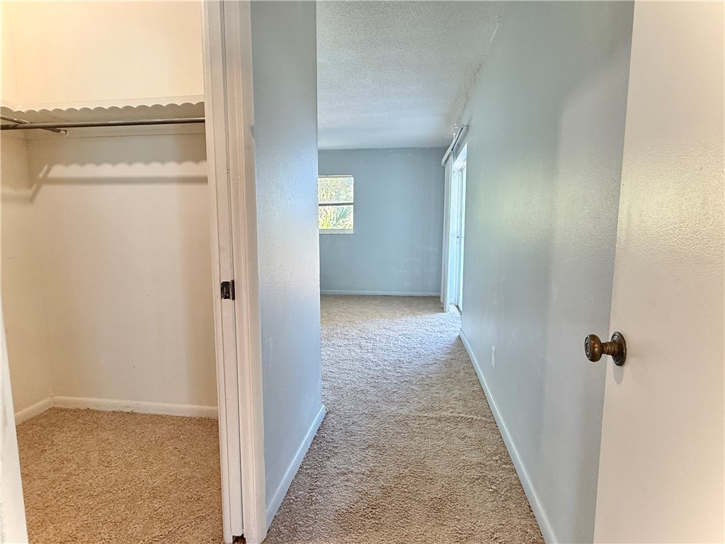 715 Holly Road Vero Beach, FL 32963 - Photo 15 of 25 a view of a hallway with wooden floor