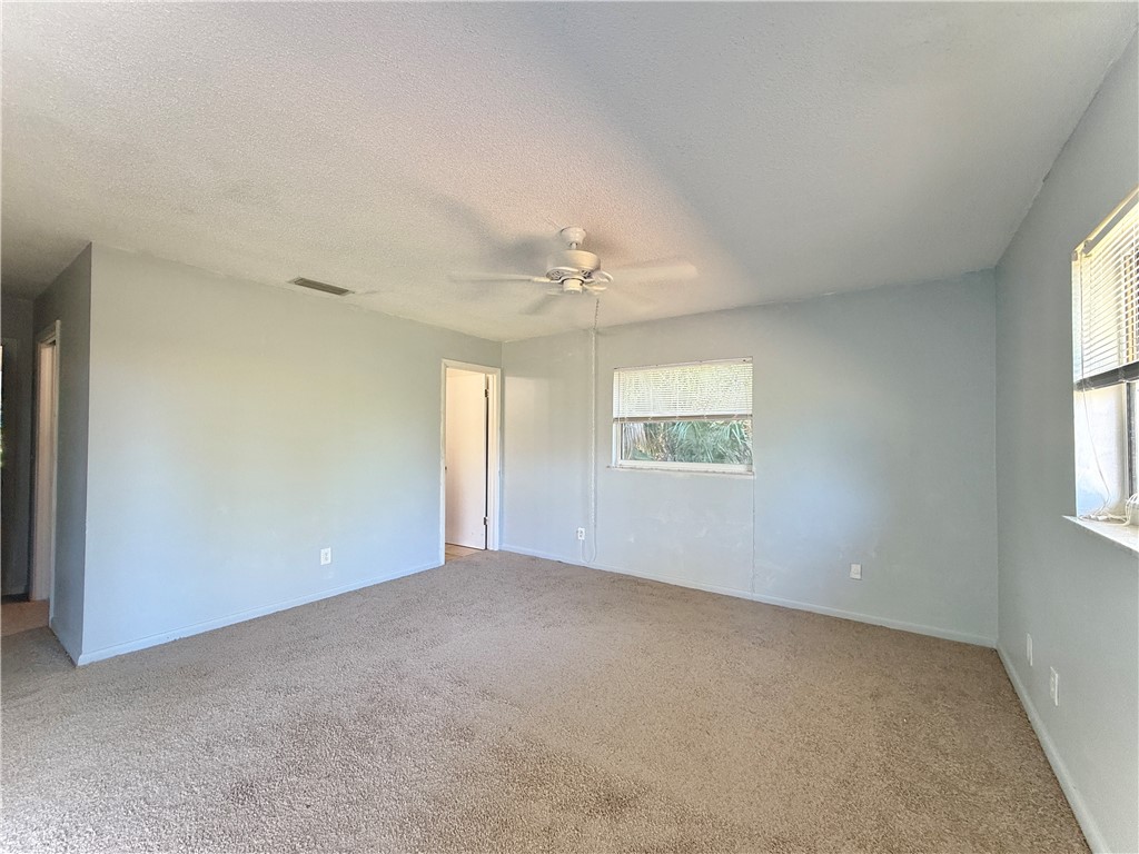 715 Holly Road Vero Beach, FL 32963 - Photo 17 of 25 an empty room with a window