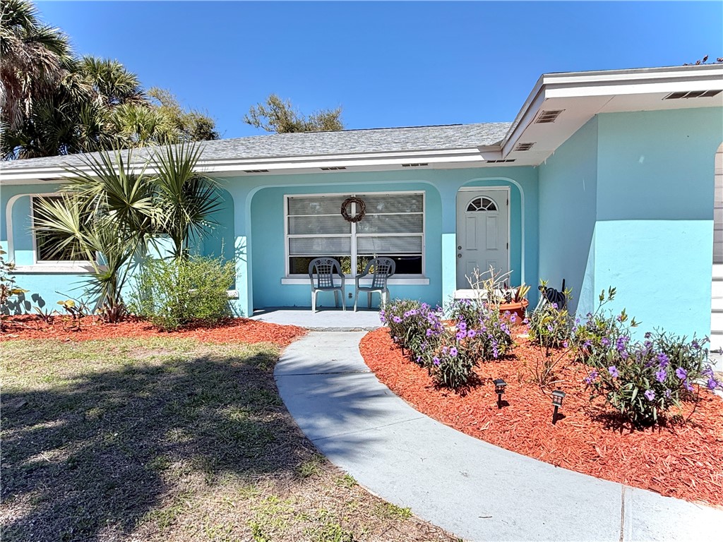 715 Holly Road Vero Beach, FL 32963 - Photo 2 of 25 front view of a house with a porch