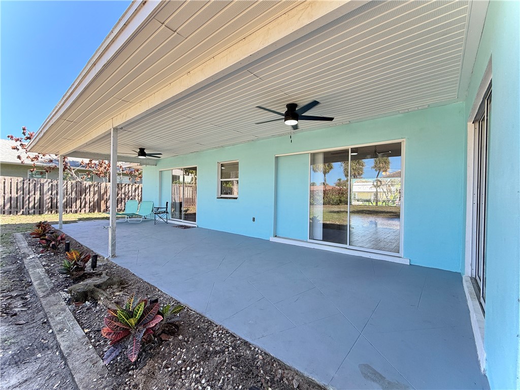 715 Holly Road Vero Beach, FL 32963 - Photo 22 of 25 a view of entryway and hall with wooden floor
