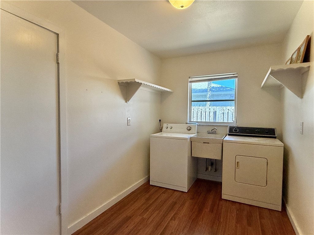 715 Holly Road Vero Beach, FL 32963 - Photo 25 of 25 a utility room with dryer and washer