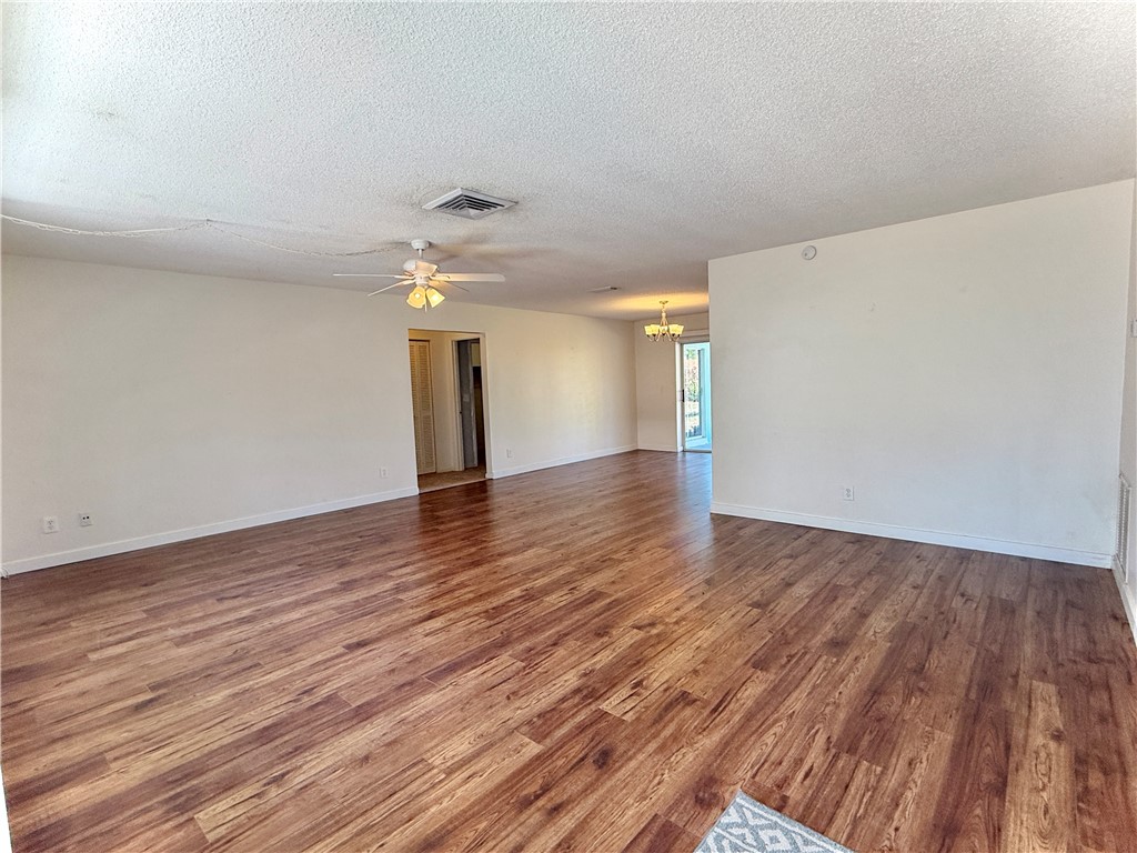 715 Holly Road Vero Beach, FL 32963 - Photo 4 of 25 a view of an empty room and wooden floor