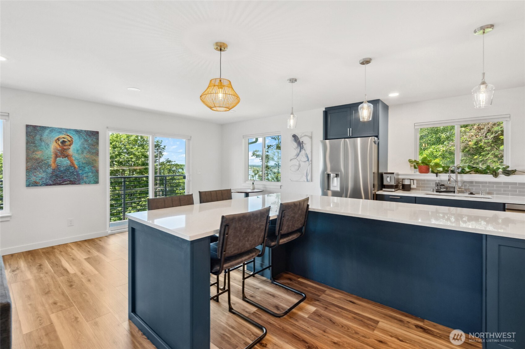 201 South State Street, Unit B Bellingham, WA 98225 - Photo 12 of 40 a dining room with wooden floor and a large window