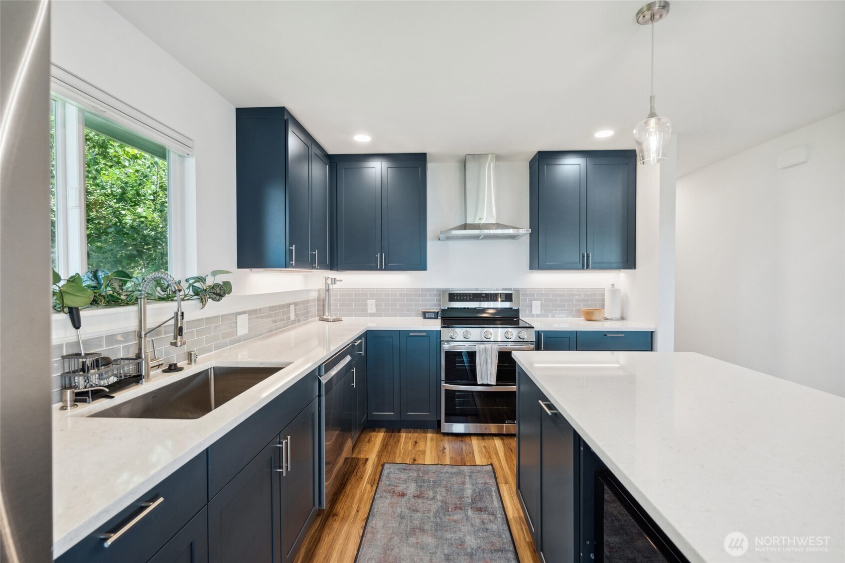 201 South State Street, Unit B Bellingham, WA 98225 - Photo 14 of 40 a kitchen with a sink stove and microwave