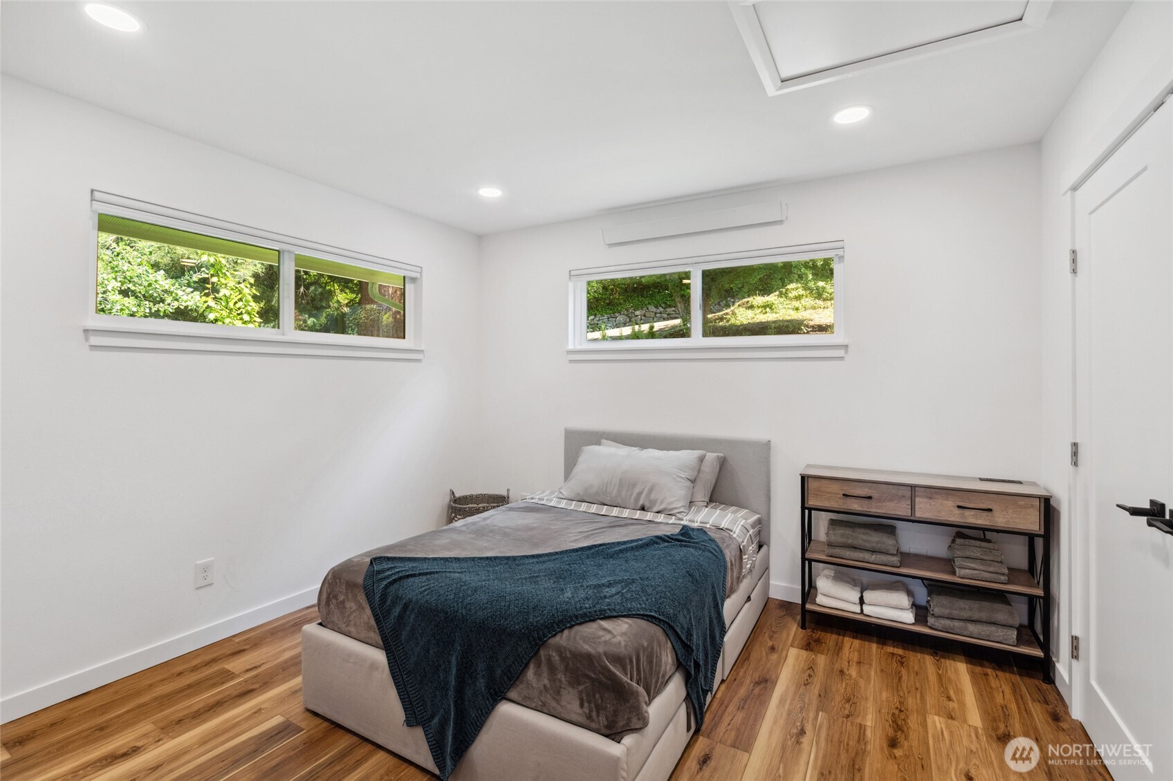 201 South State Street, Unit B Bellingham, WA 98225 - Photo 21 of 40 a bedroom with a bed and a dresser