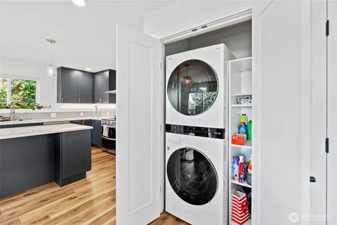 a view of a hallway with washer and dryer