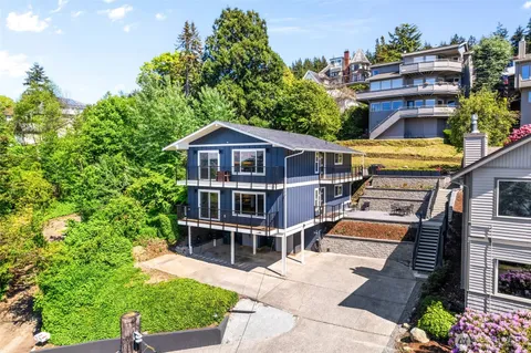 an aerial view of a house with a yard