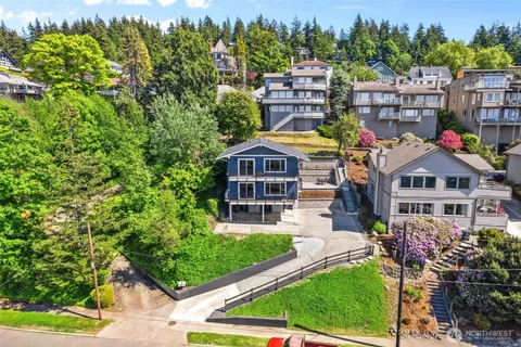 a aerial view of a house with a yard