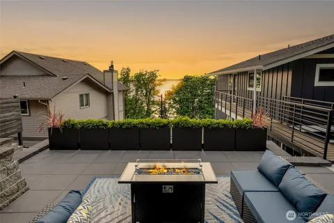 a view of a house with couches in front of it