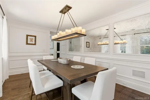 a view of a dining room a table and chairs