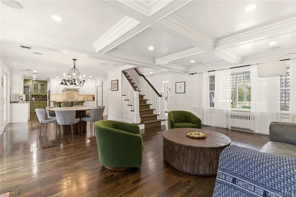a living room with furniture rug and window