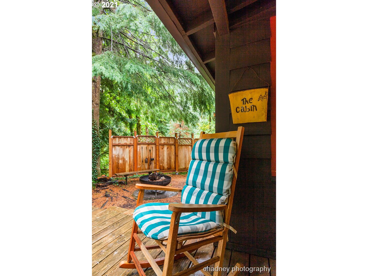 71594 East Minikahda Avenue Rhododendron, OR 97049 - Photo 22 of 27 a balcony with two chairs and a table