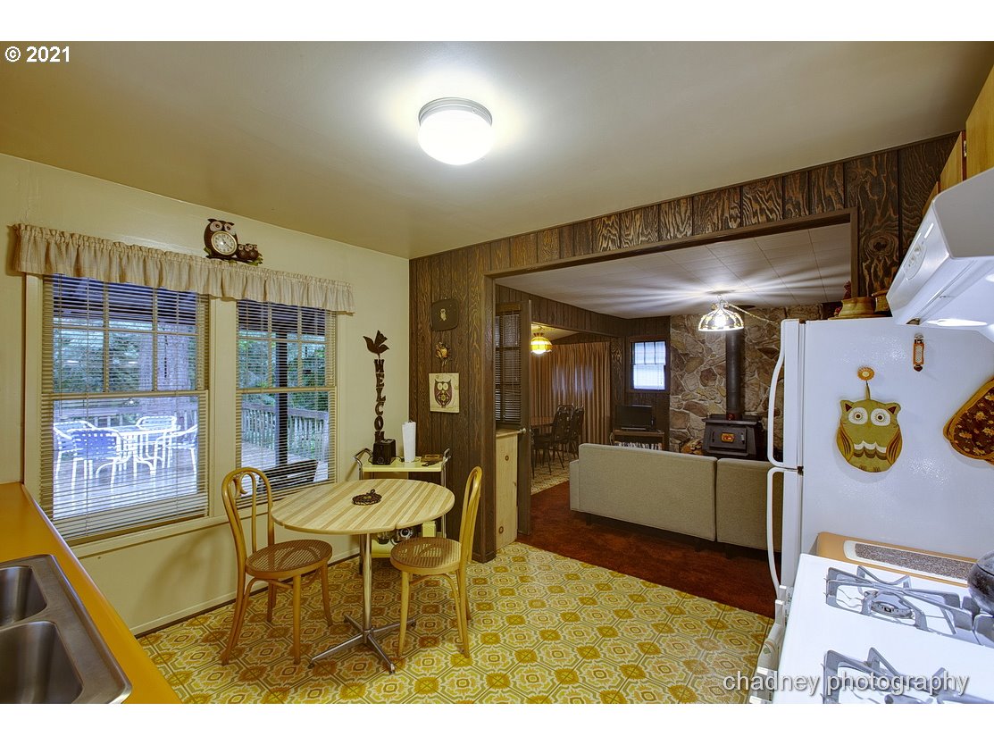 71594 East Minikahda Avenue Rhododendron, OR 97049 - Photo 8 of 27 a dining room with furniture and a window