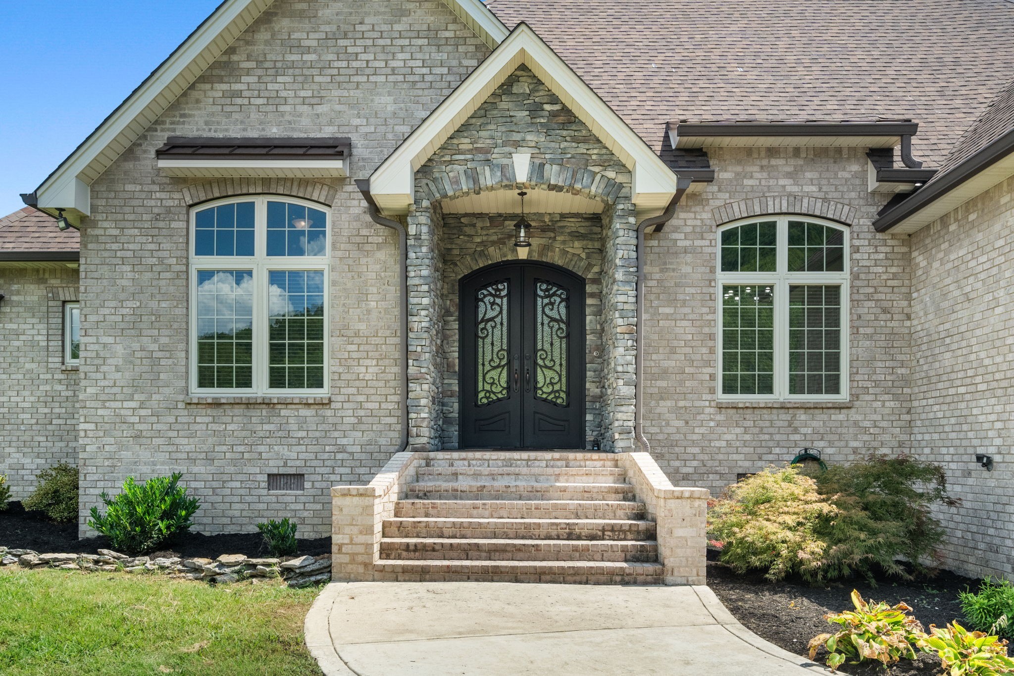 508 Lindsey Hollow Road Gallatin, TN 37066 - Photo 6 of 33 Stack stone front entrance with exquisite iron front doors.