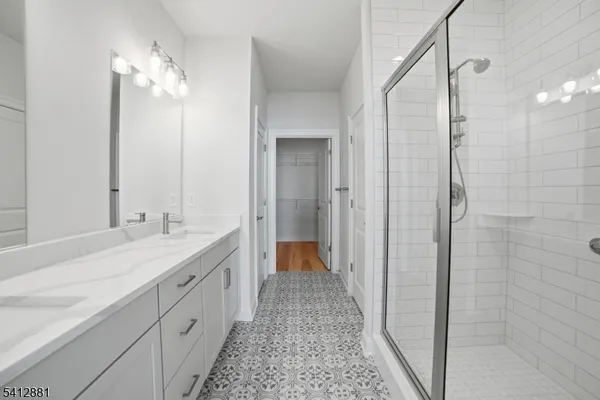 a view of a room with wooden floor and bathroom