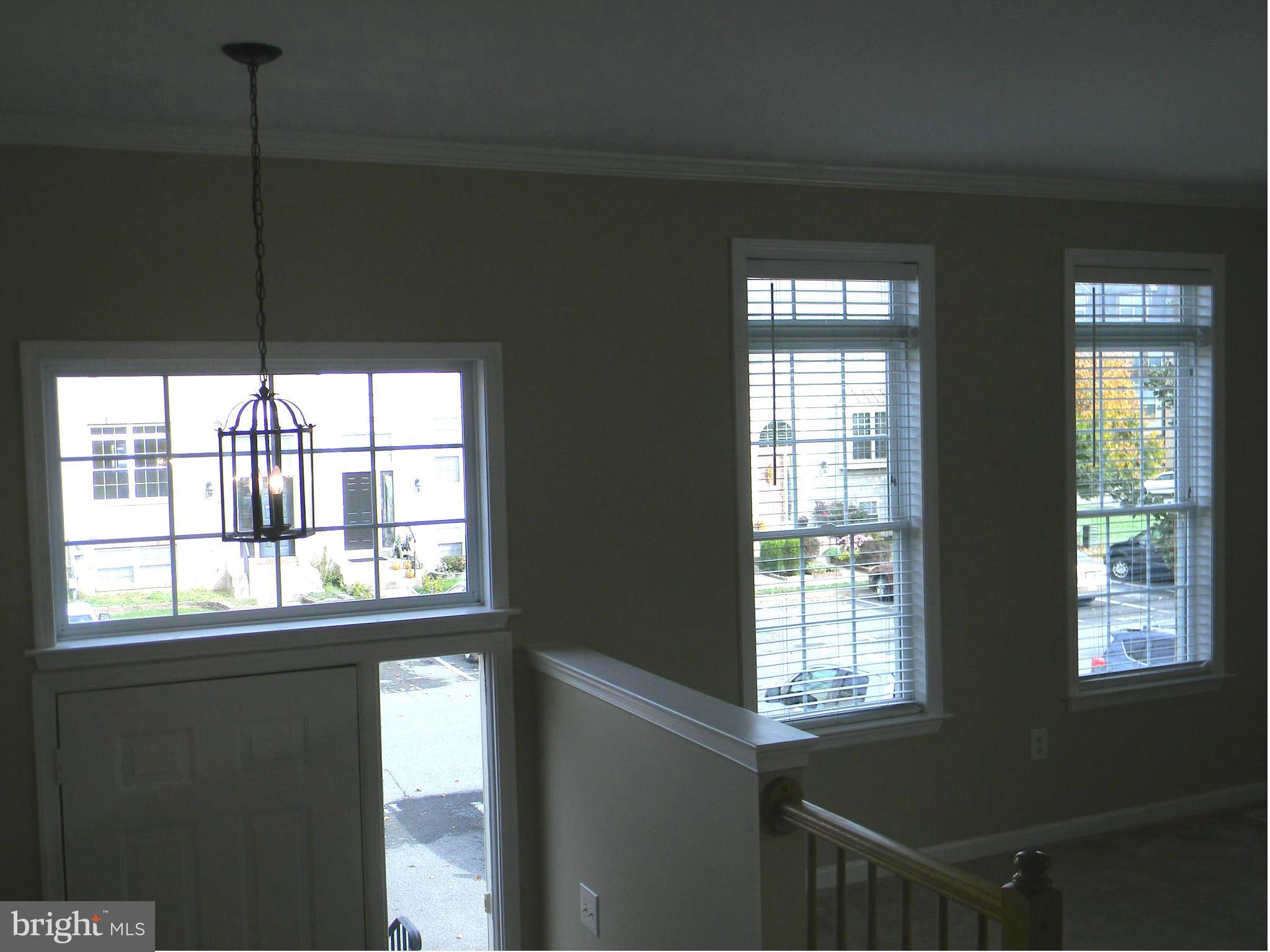 1513 Rambling Way South Frederick, MD 21701 - Photo 5 of 29 DRAMATIC TRANSOM WINDOW & CHANDELIER IN FOYER
