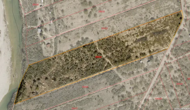 a view of a town with mountains in the background